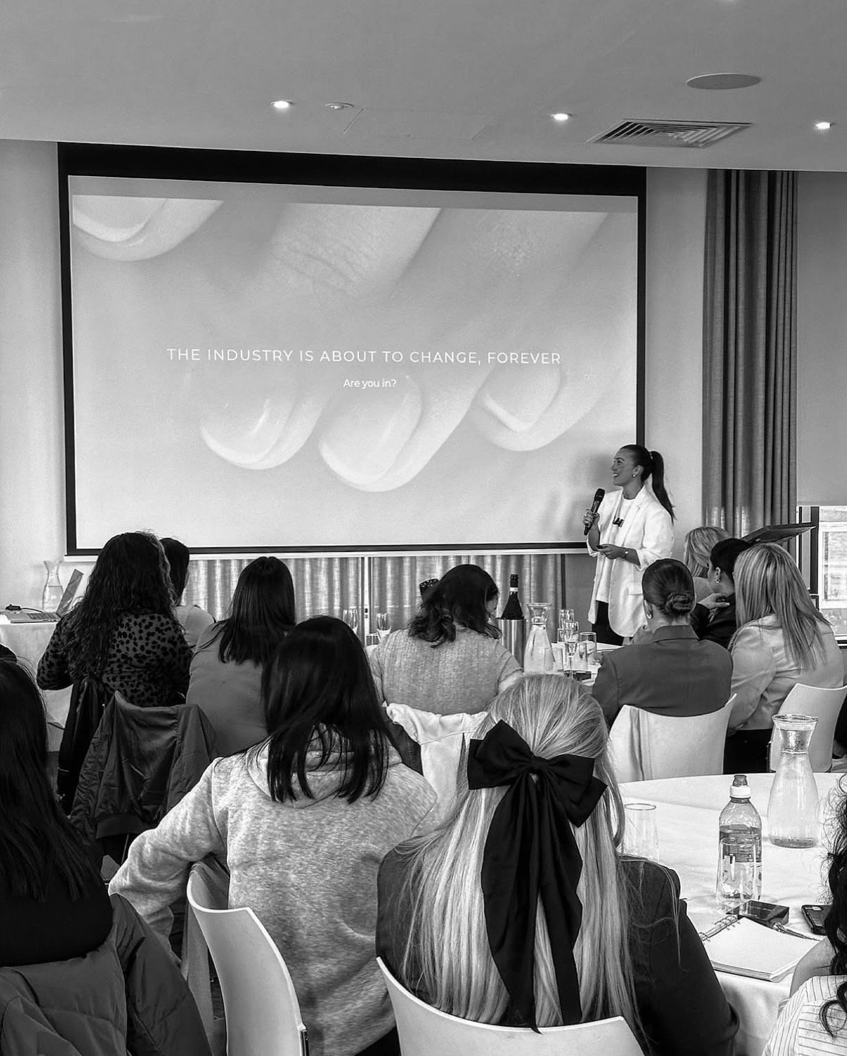 Amy Guy presenting to a room of business owners