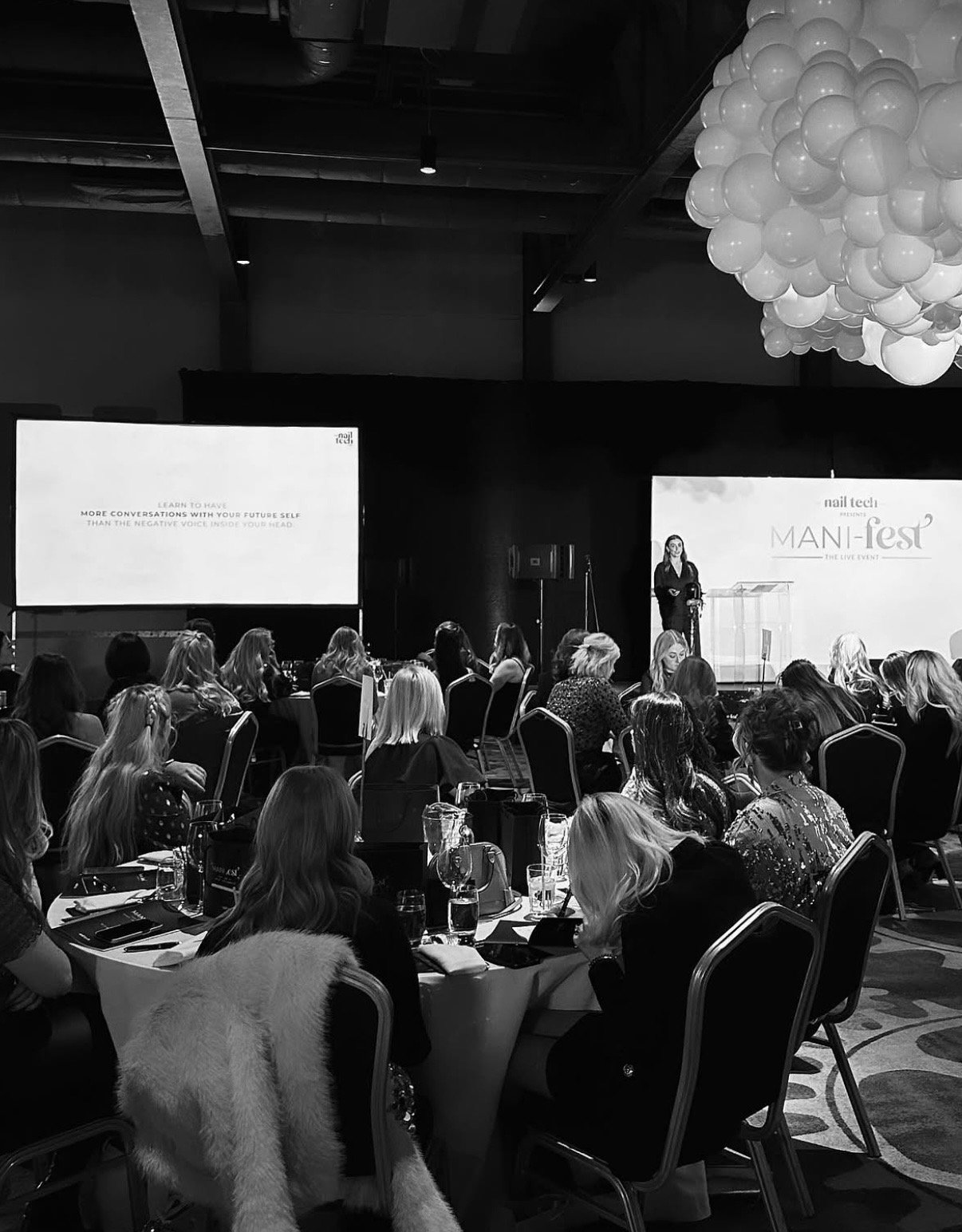 Amy Guy on stage at the Mani-fest live event