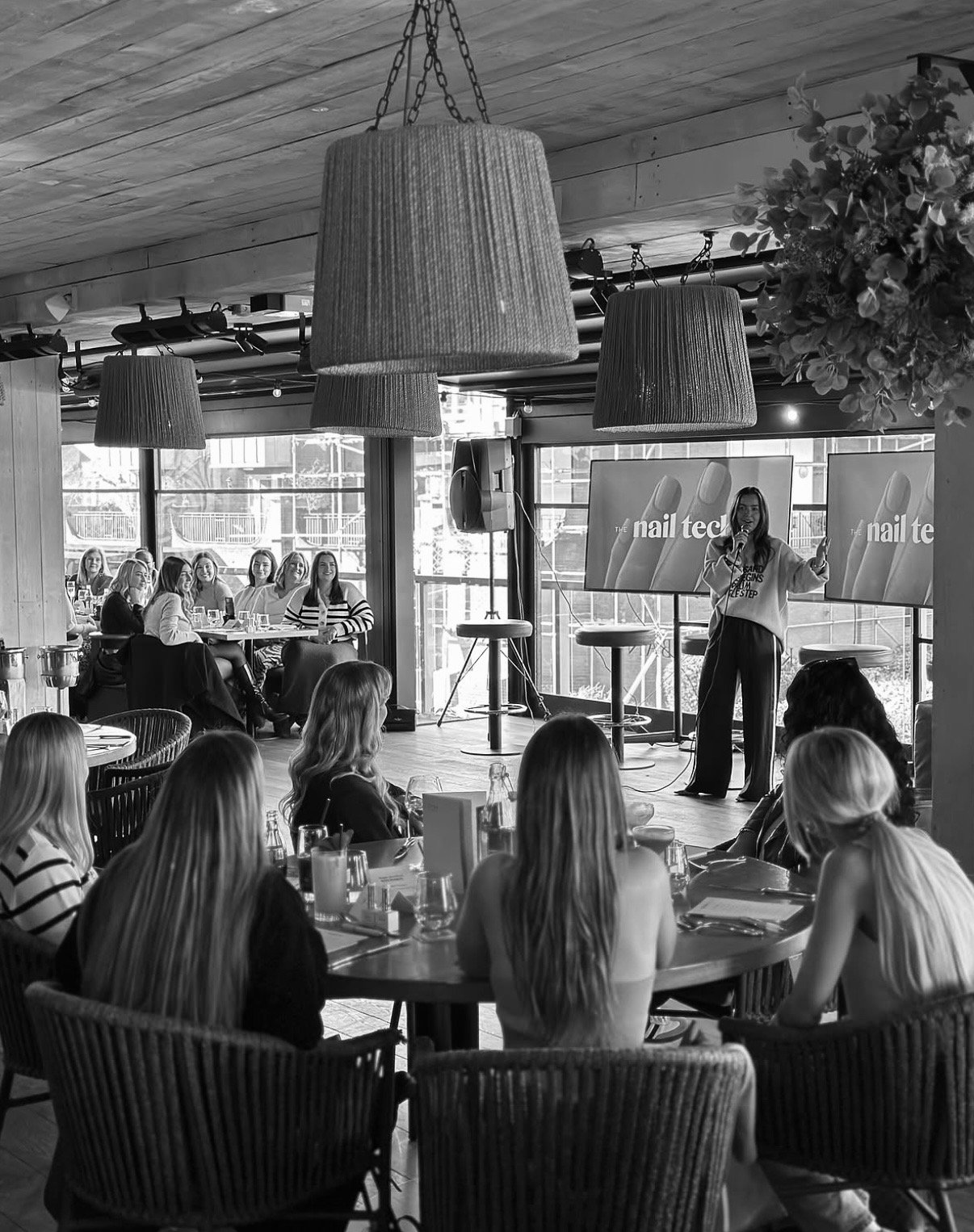 Amy Guy speaking at a The Nail Tech Org event
